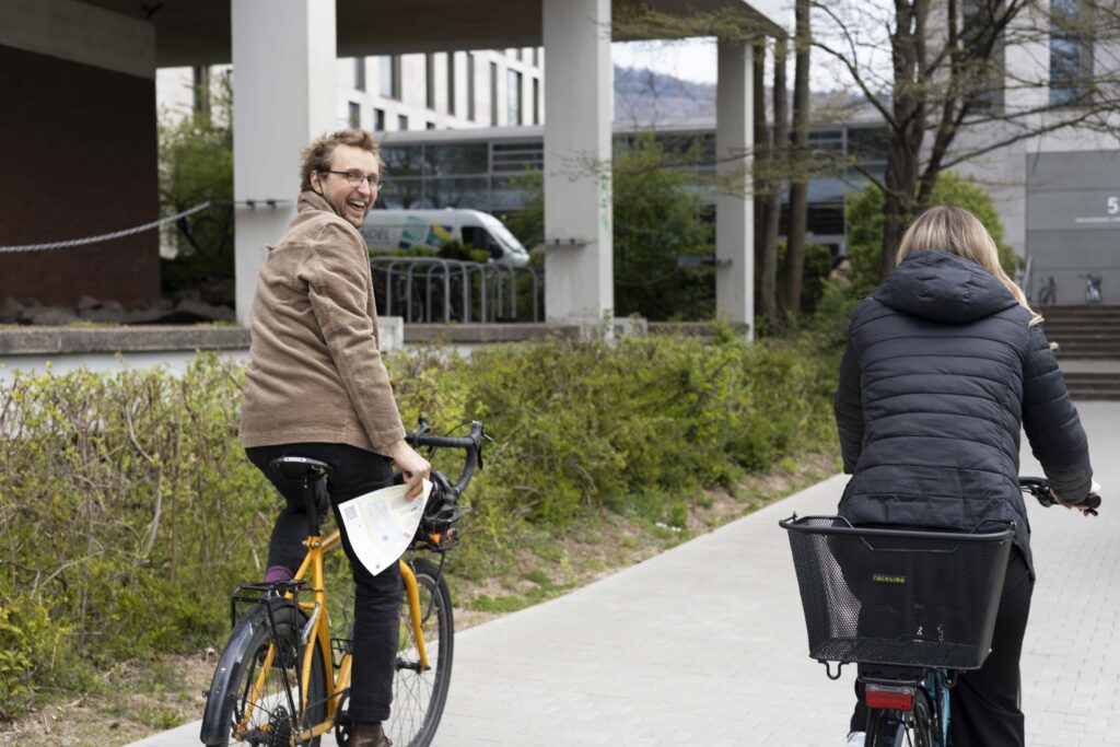 two people riding a bike