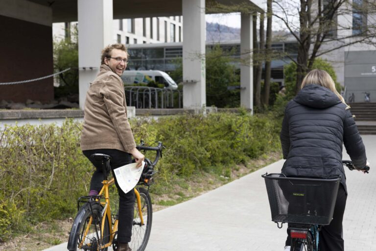 two people riding a bike