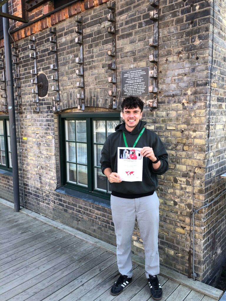 man holding a certificate