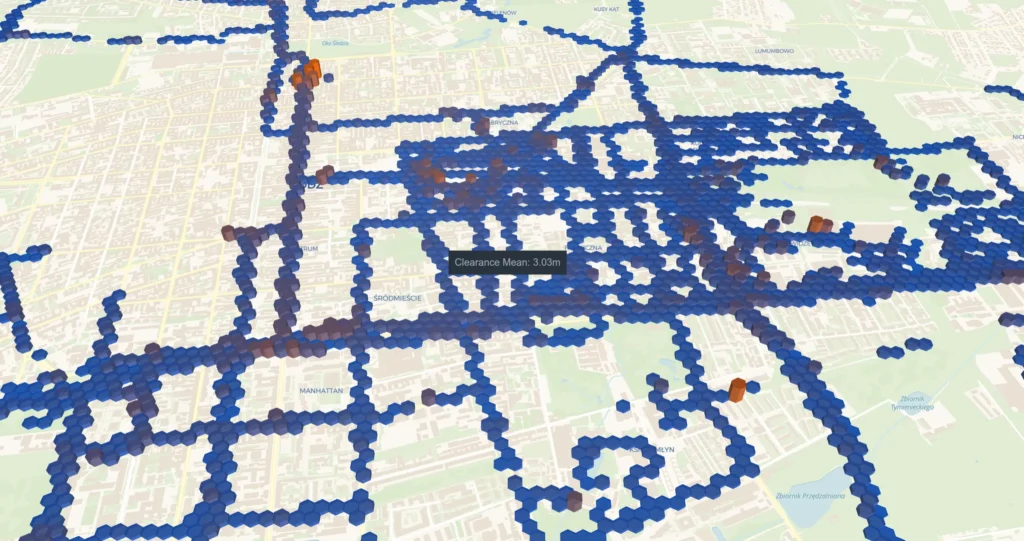 3D map showing a network of blue and some orange dots over a city view