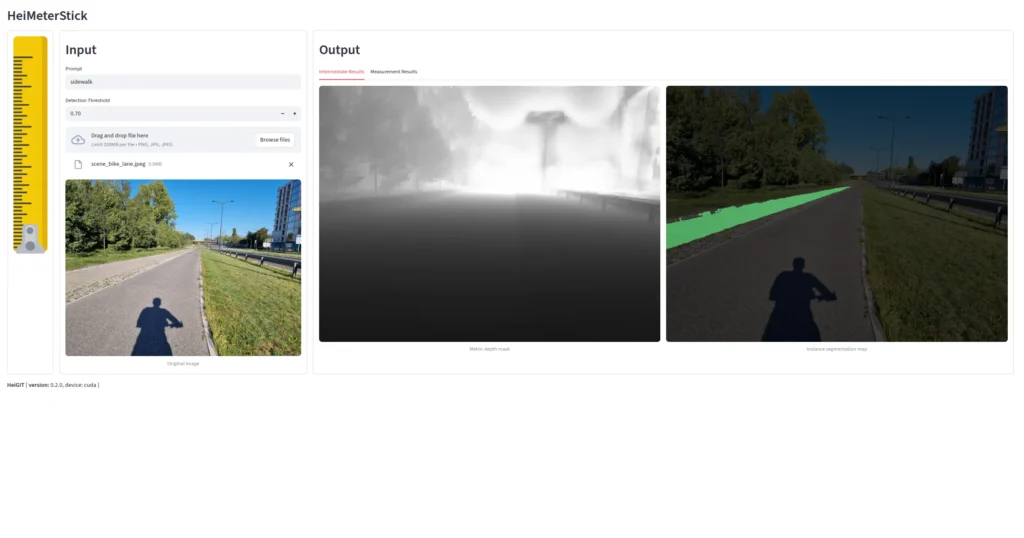 Shadow of a person on a bike path next to a road with trees and buildings in the background