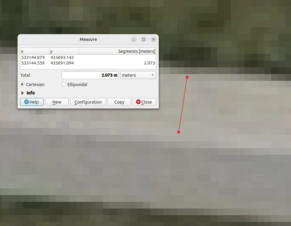 Screenshot of a measurement tool showing coordinates and a measured segment of 2.073 meters on a blurry pixelated surface